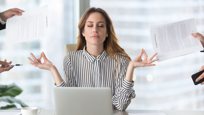 Calm,Female,Executive,Meditating,Taking,Break,At,Work,For,Mental